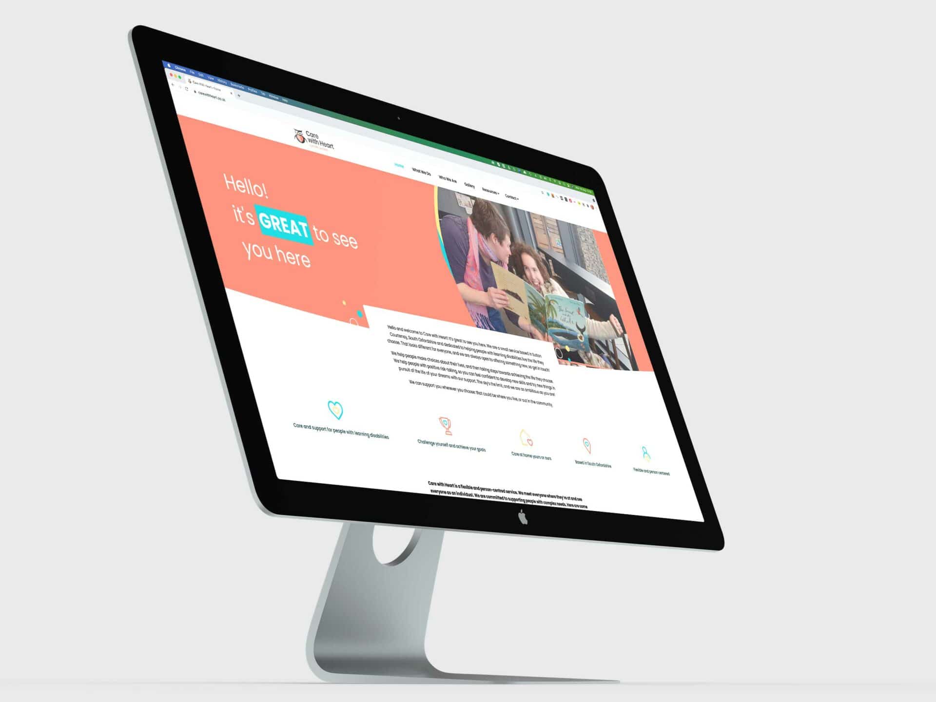 The Care With Heart website displayed on an iMac