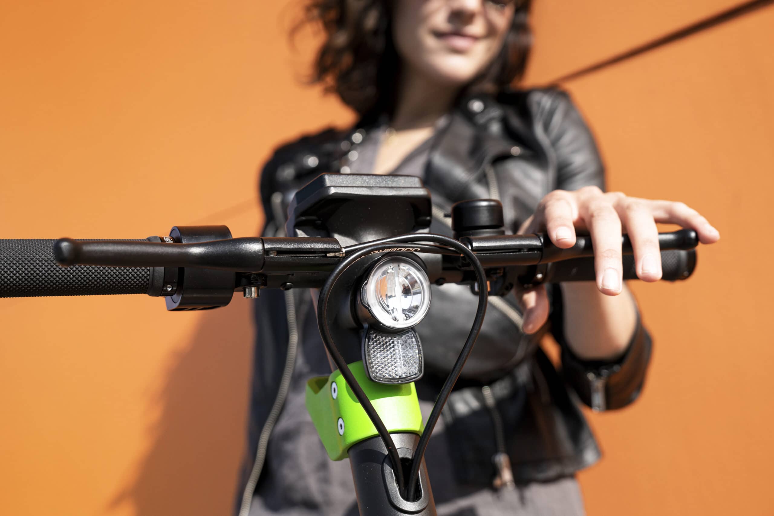 A close up of an electric scooter's handlebar