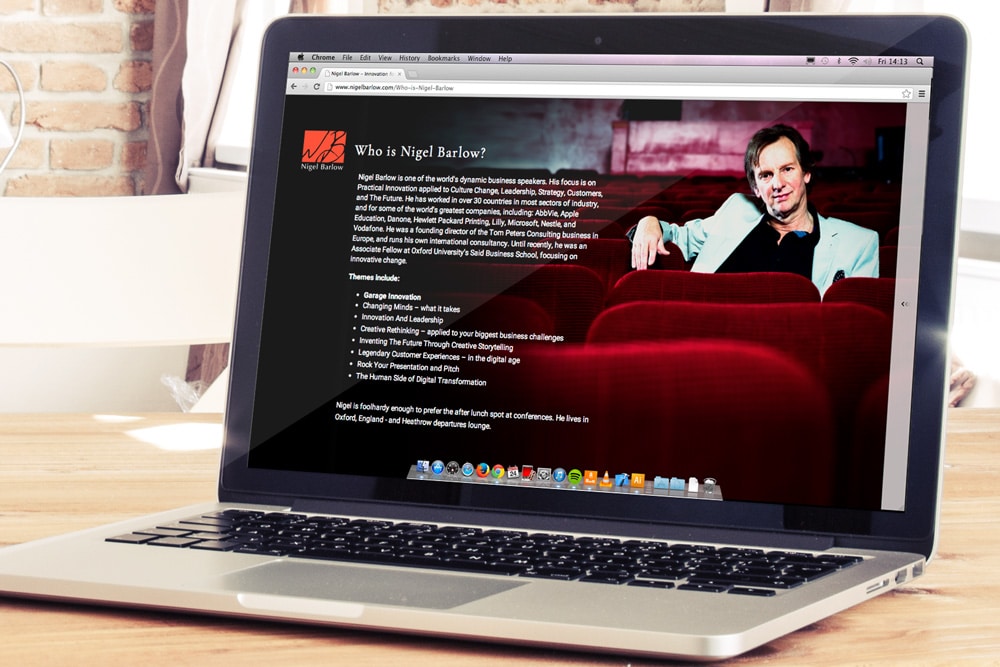 The Nigel Barlow website displayed on a laptop